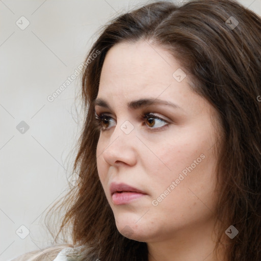 Neutral white young-adult female with long  brown hair and brown eyes