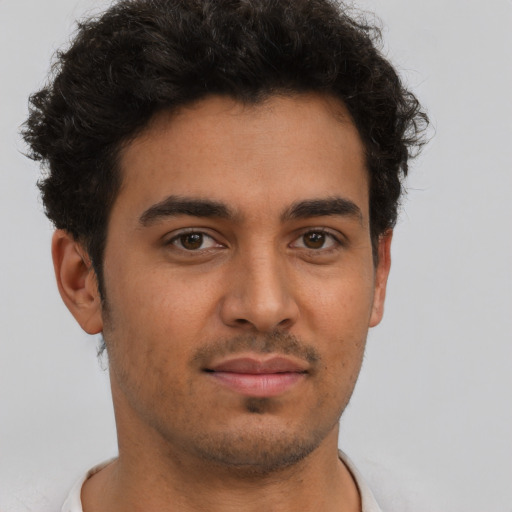 Neutral latino young-adult male with short  brown hair and brown eyes