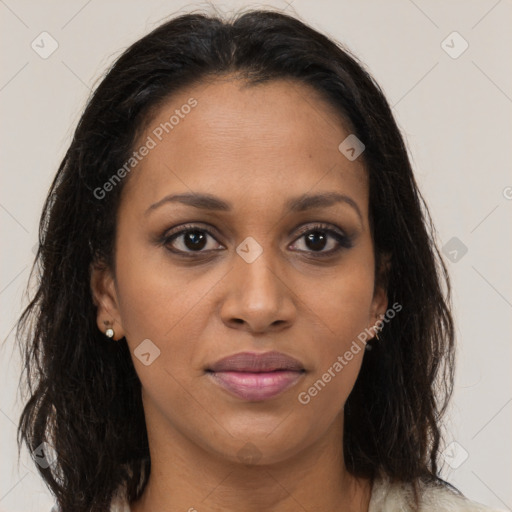 Joyful black young-adult female with long  brown hair and brown eyes