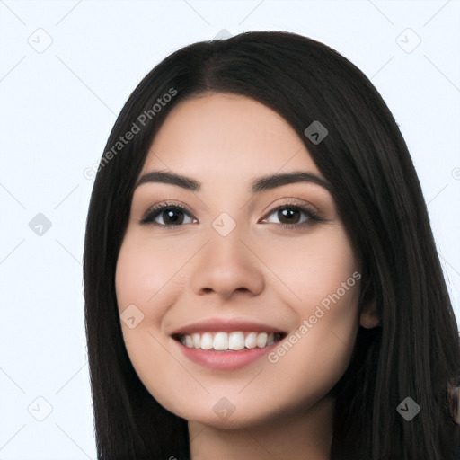 Joyful latino young-adult female with long  black hair and brown eyes