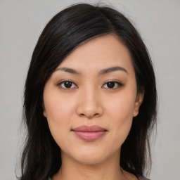 Joyful asian young-adult female with medium  black hair and brown eyes