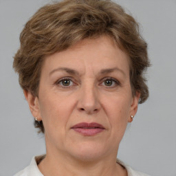 Joyful white adult female with short  brown hair and grey eyes