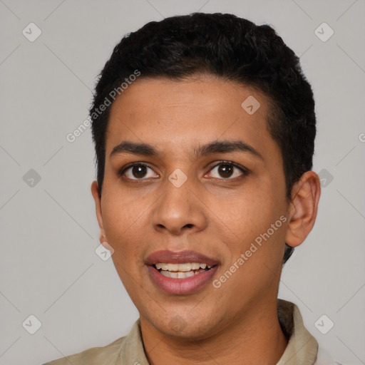 Joyful latino young-adult male with short  black hair and brown eyes