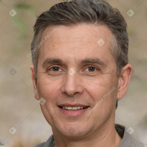 Joyful white adult male with short  brown hair and brown eyes