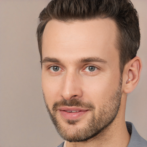 Joyful white young-adult male with short  brown hair and brown eyes