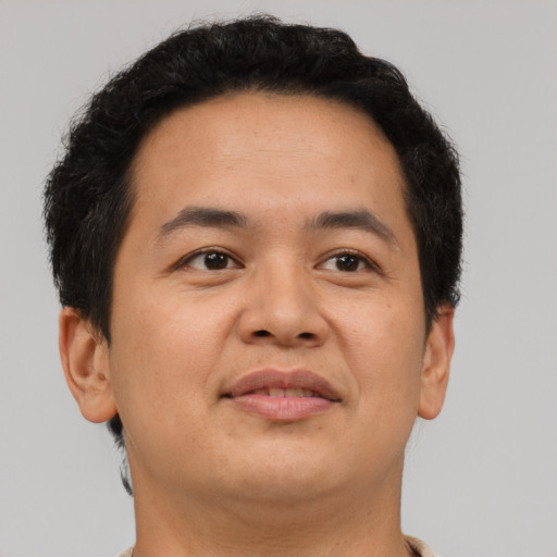 Neutral asian adult male with short  brown hair and brown eyes