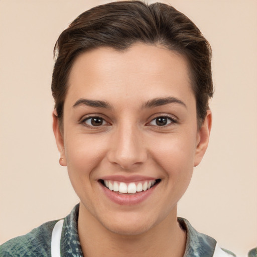 Joyful white young-adult female with short  brown hair and brown eyes