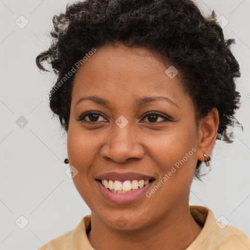 Joyful black young-adult female with short  brown hair and brown eyes