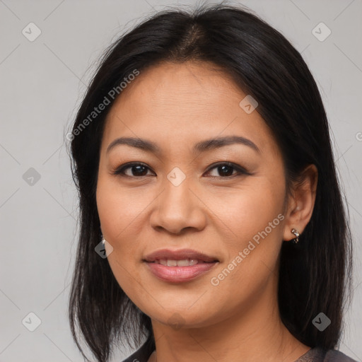 Joyful asian young-adult female with long  brown hair and brown eyes