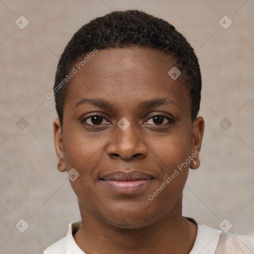 Joyful black young-adult female with short  black hair and brown eyes