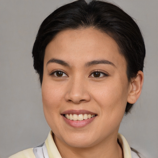 Joyful white young-adult female with medium  brown hair and brown eyes