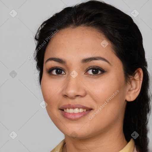 Joyful latino young-adult female with long  brown hair and brown eyes