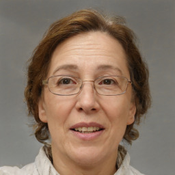 Joyful white middle-aged female with medium  brown hair and brown eyes