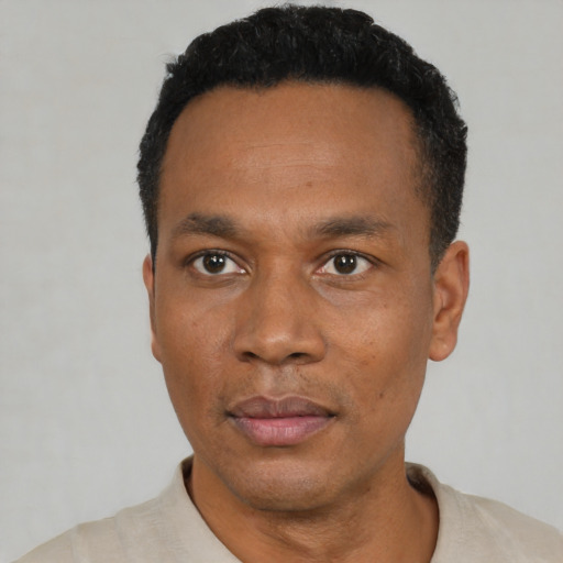 Neutral black adult male with short  black hair and brown eyes