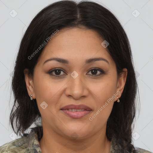 Joyful latino adult female with medium  brown hair and brown eyes