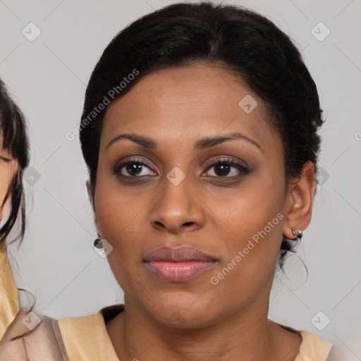 Joyful black young-adult female with medium  brown hair and brown eyes