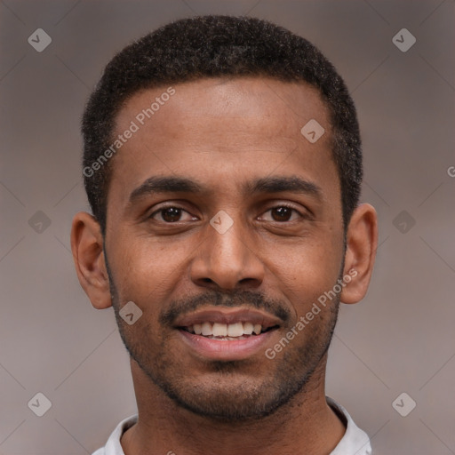 Joyful black young-adult male with short  black hair and brown eyes