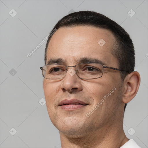 Joyful white adult male with short  black hair and brown eyes