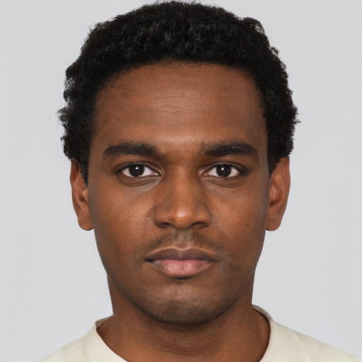 Neutral black young-adult male with short  black hair and brown eyes