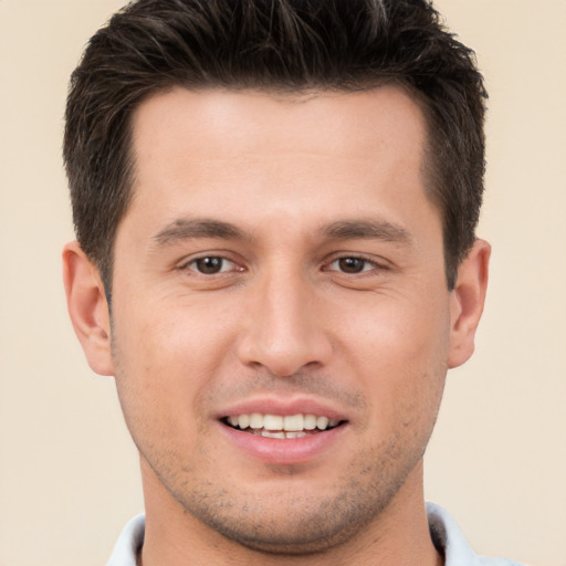 Joyful white young-adult male with short  brown hair and brown eyes