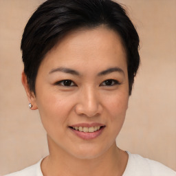 Joyful asian young-adult female with short  brown hair and brown eyes