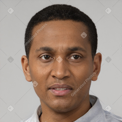 Joyful black young-adult male with short  black hair and brown eyes