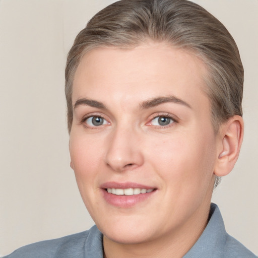 Joyful white adult female with short  brown hair and brown eyes