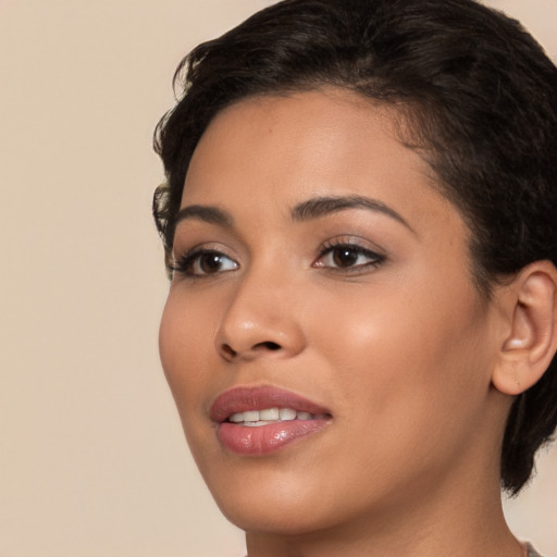 Joyful latino young-adult female with short  brown hair and brown eyes