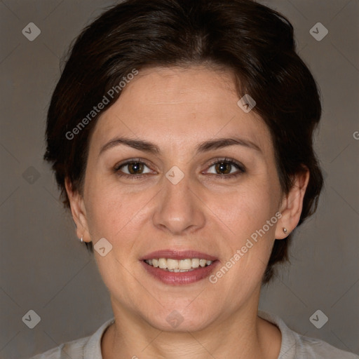 Joyful white adult female with medium  brown hair and brown eyes