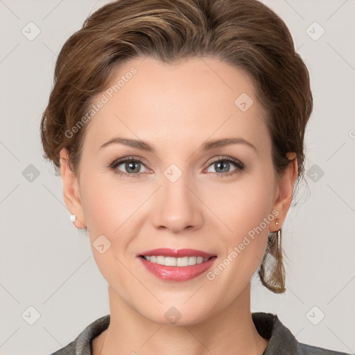 Joyful white young-adult female with medium  brown hair and grey eyes