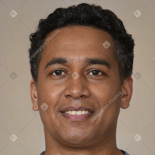 Joyful latino young-adult male with short  brown hair and brown eyes