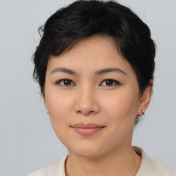 Joyful asian young-adult female with medium  black hair and brown eyes