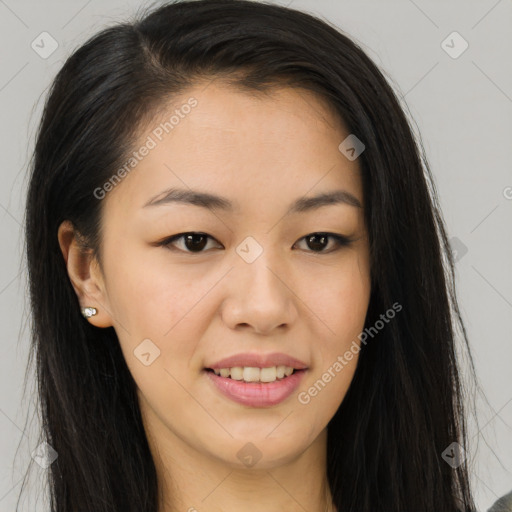 Joyful asian young-adult female with long  brown hair and brown eyes