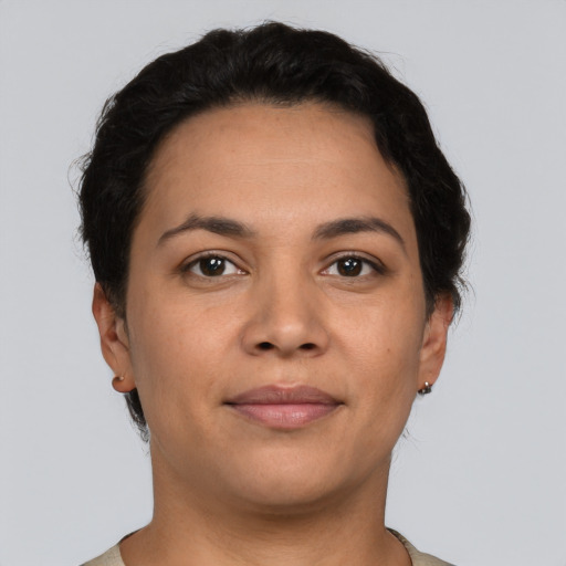 Joyful latino young-adult female with short  brown hair and brown eyes