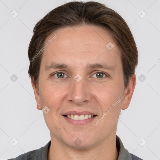 Joyful white adult male with short  brown hair and grey eyes