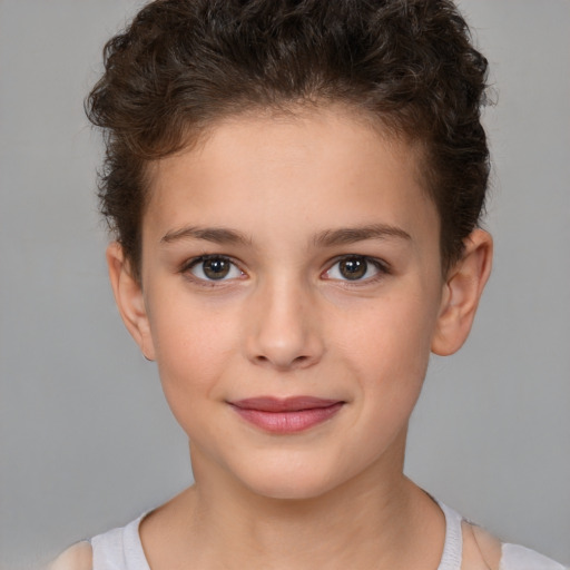 Joyful white child female with short  brown hair and brown eyes