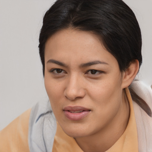 Joyful white young-adult female with medium  brown hair and brown eyes
