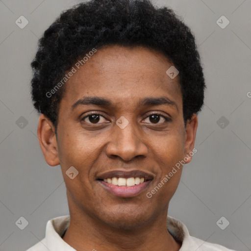 Joyful black young-adult male with short  black hair and brown eyes