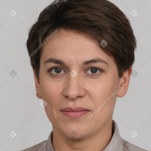 Joyful white adult female with short  brown hair and brown eyes