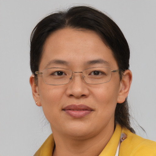 Joyful asian adult female with short  brown hair and brown eyes