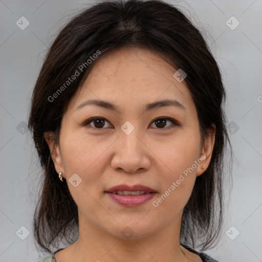 Joyful asian young-adult female with medium  brown hair and brown eyes