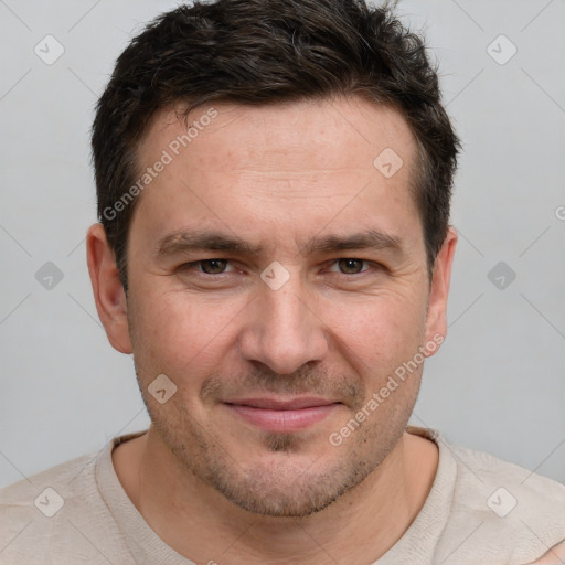 Joyful white adult male with short  brown hair and brown eyes