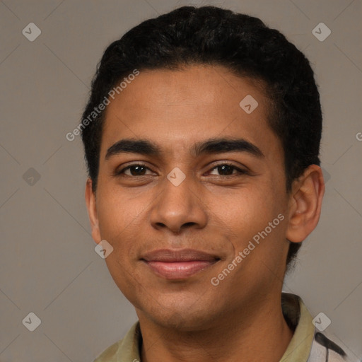 Joyful latino young-adult male with short  brown hair and brown eyes