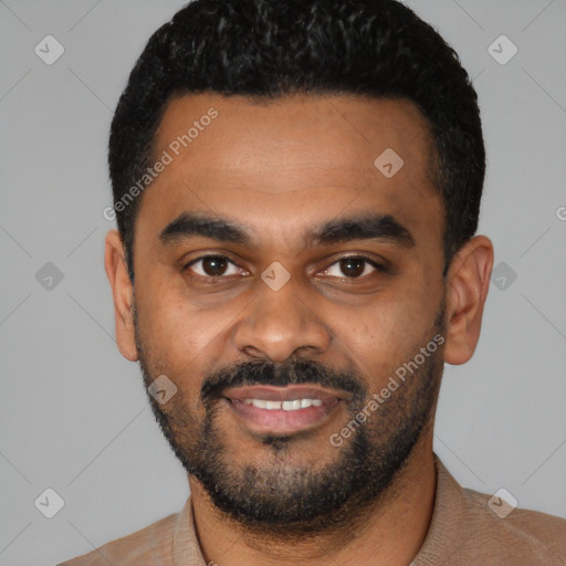 Joyful black young-adult male with short  black hair and brown eyes