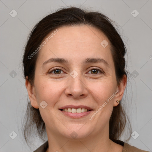 Joyful white adult female with medium  brown hair and grey eyes