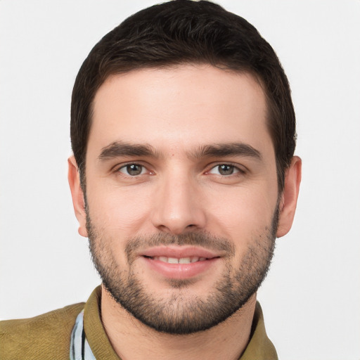 Joyful white young-adult male with short  brown hair and brown eyes