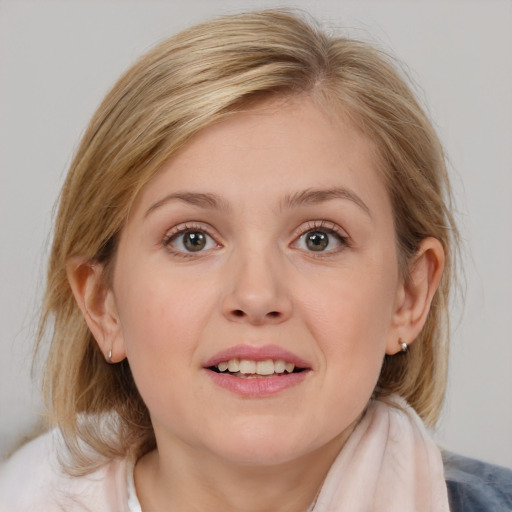 Joyful white young-adult female with medium  brown hair and blue eyes