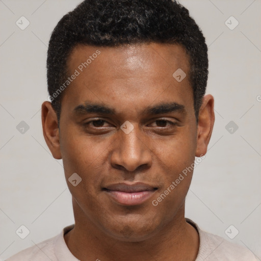 Joyful black young-adult male with short  black hair and brown eyes