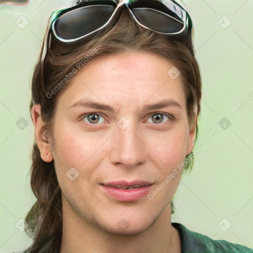 Joyful white young-adult female with medium  brown hair and green eyes