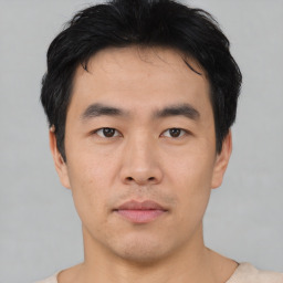 Neutral asian young-adult male with short  black hair and brown eyes